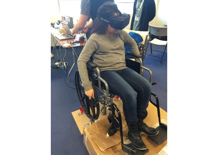 A person in a wheelchair using VR.
